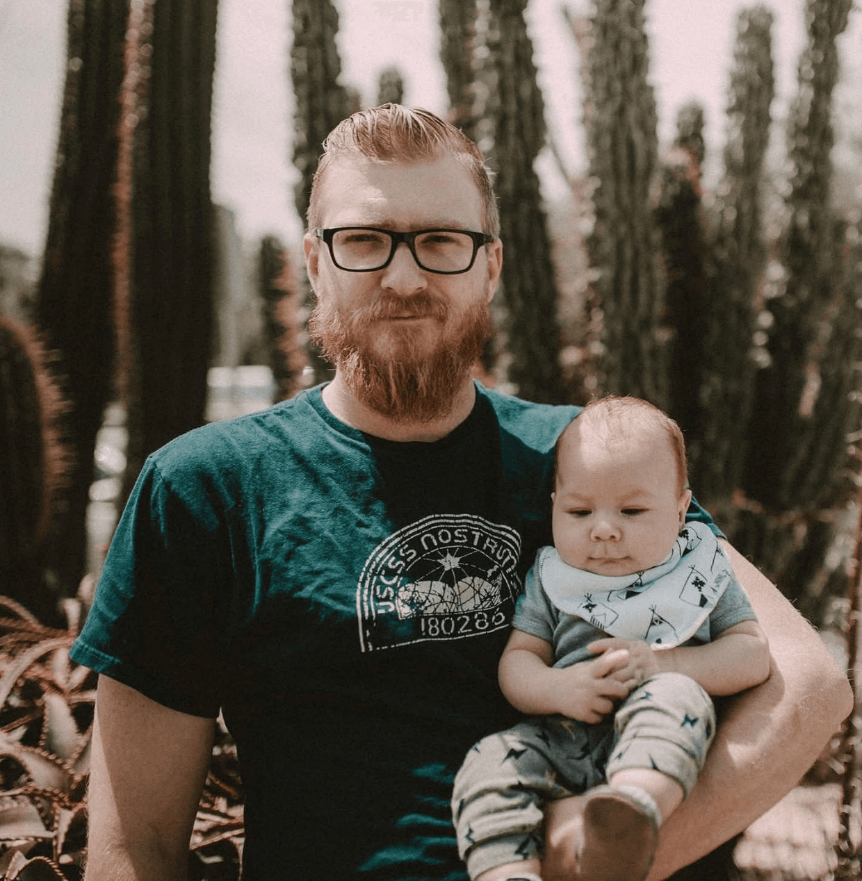 The owner of Jaybird Residential holding his young son
