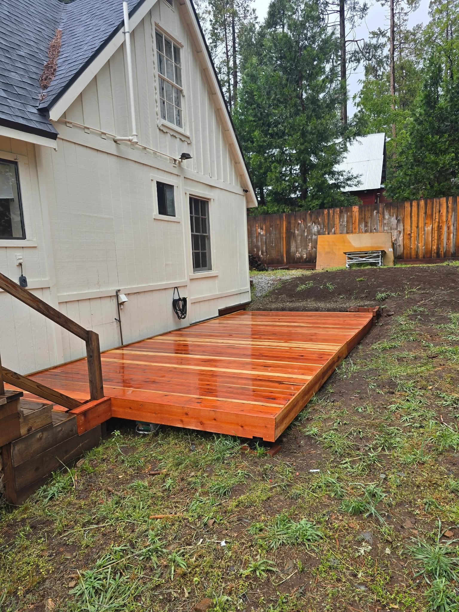Finished redwood deck built off the back of a cabin